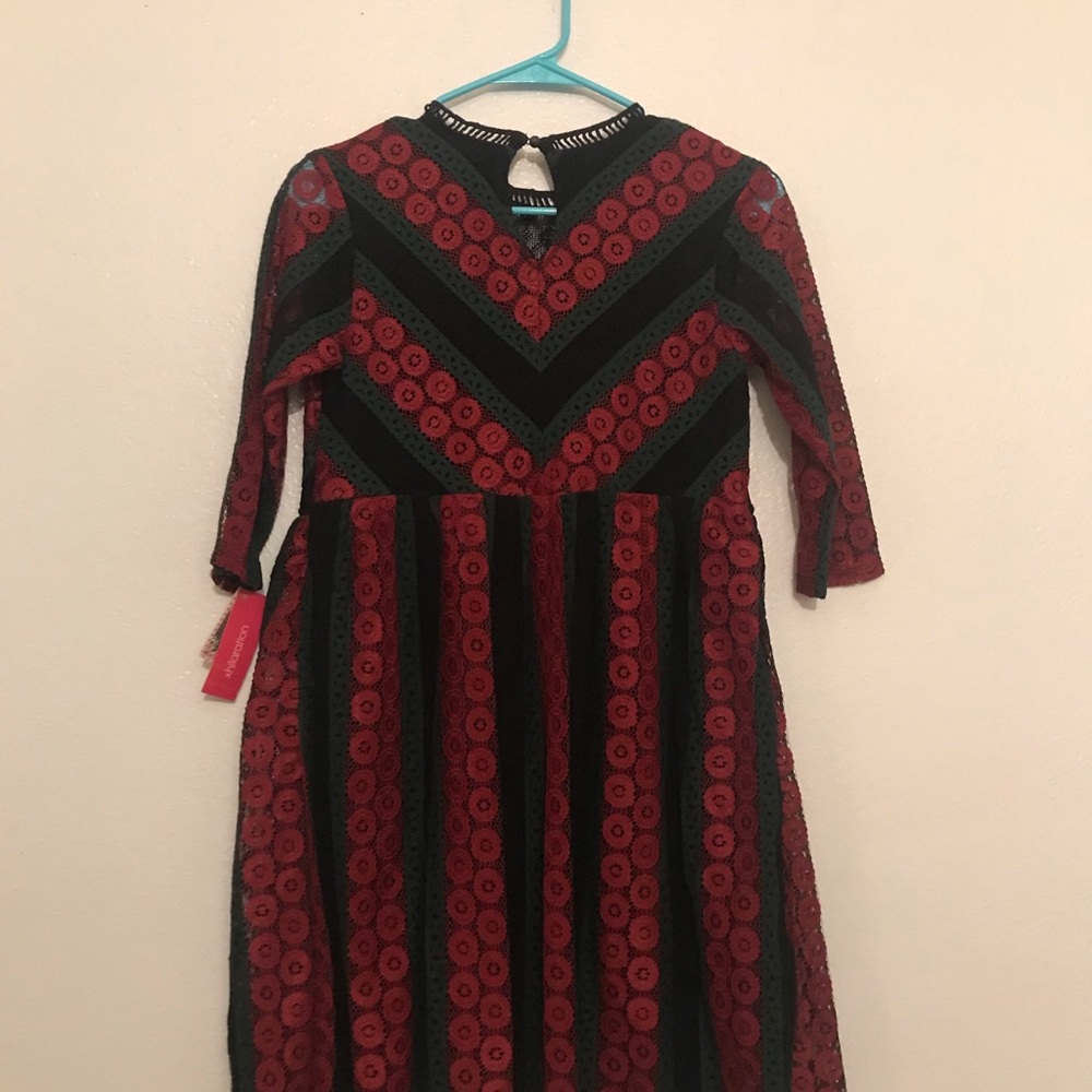 Embroidered jewel tone dress.